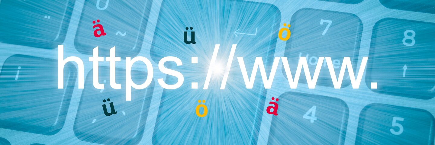 Abbildung einer Tastatur mit Umlauten ä, ö, ü und grossem https://www. Schriftzug als Symbol für Domains mit Umlauten