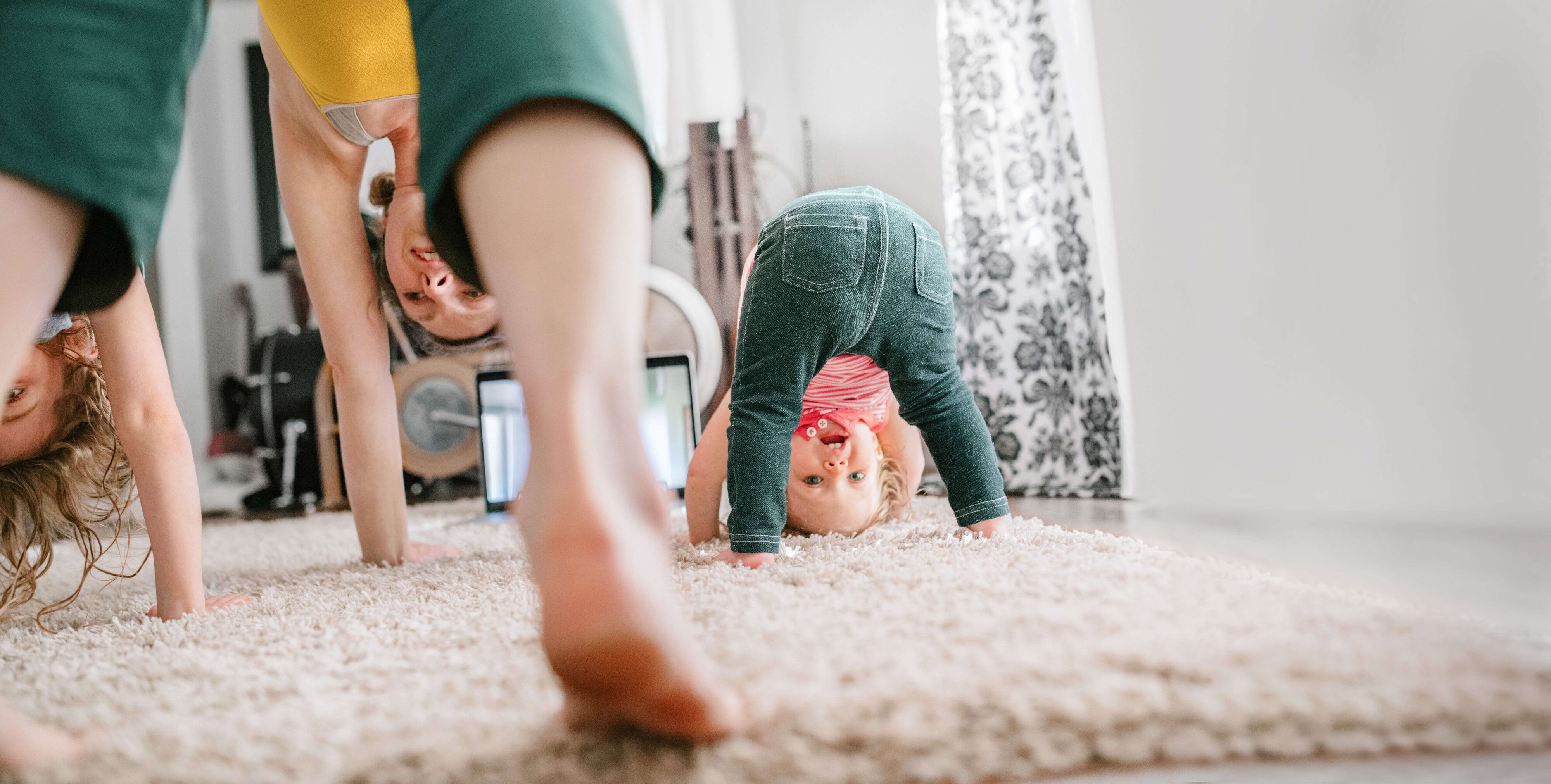 Mother with children doing yoga at home