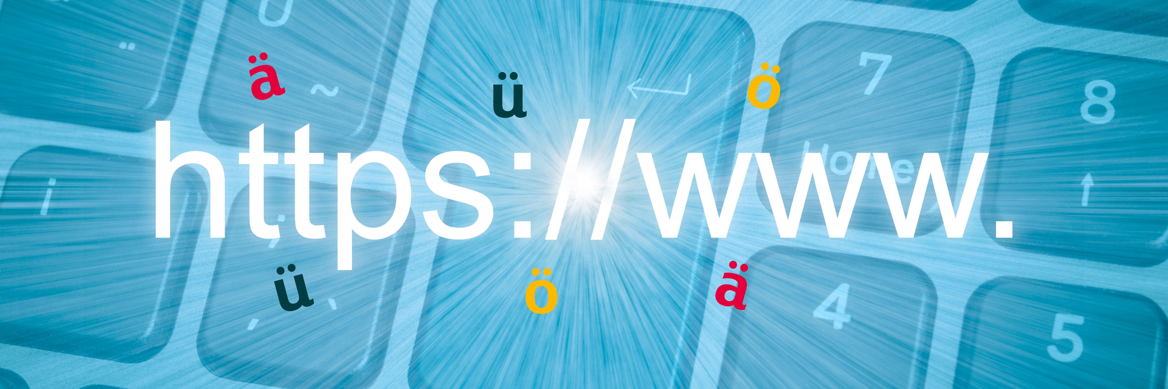 Abbildung einer Tastatur mit Umlauten ä, ö, ü und grossem https://www. Schriftzug als Symbol für Domains mit Umlauten